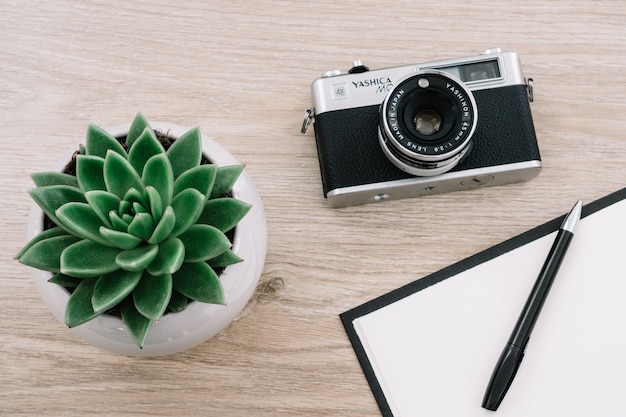 Pen on a notebook with a camera