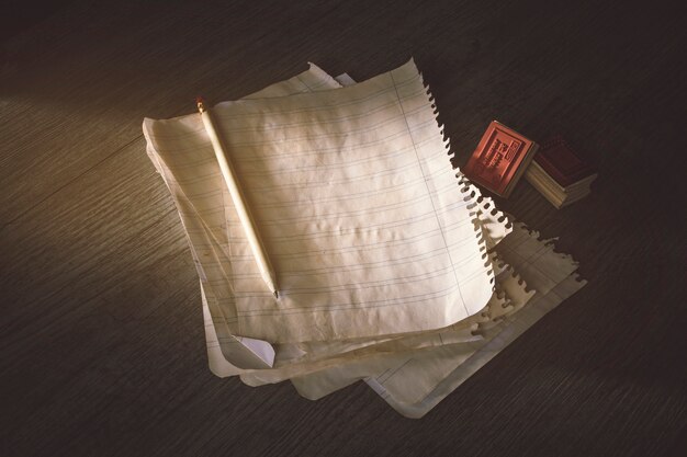 Pencil and stamps near ancient paper sheets