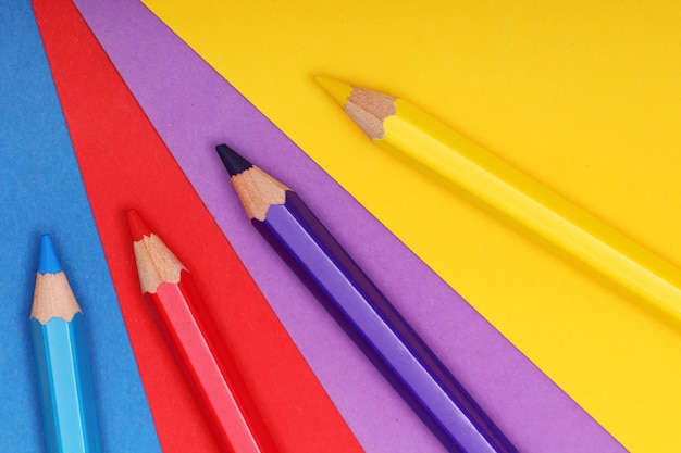Free photo pencils on colorful paper