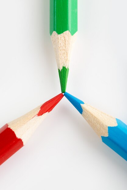 Pencils colorful triangle shaped for drawing a top view on white wall