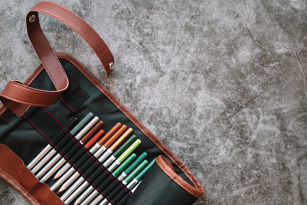 Free photo pencils in leather bag