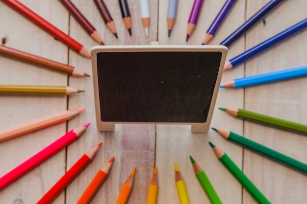 Pencils and small blackboard