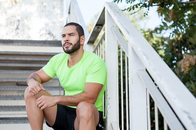 Pensive brutal man contemplating nature around