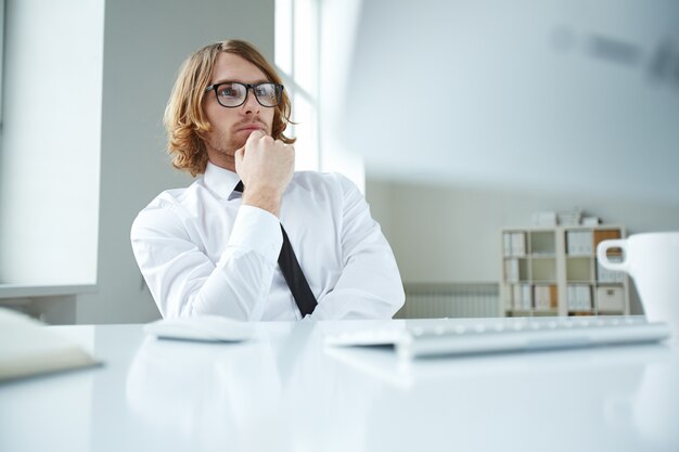 Pensive businessman with glasses and shirt