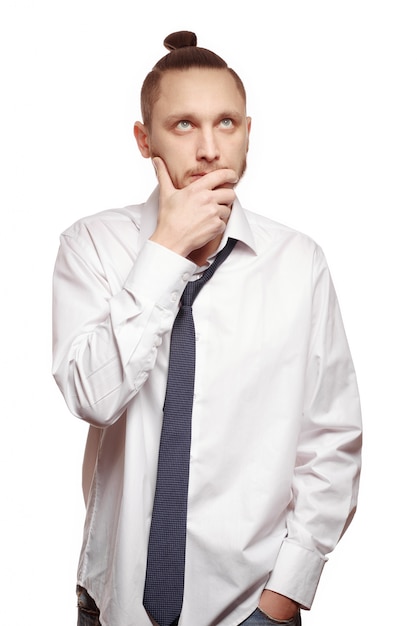 Pensive businessman with a modern hairstyle