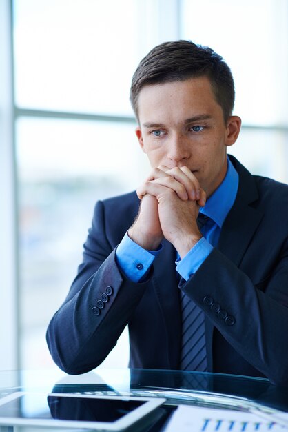 Pensive businessman at work