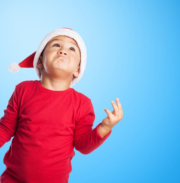 Pensive child with blue background