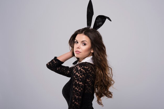 Pensive easter bunny in black lace costume