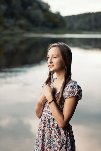 Free photo pensive girl touching her hair