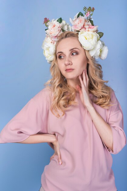 Pensive lady with flowers on head 