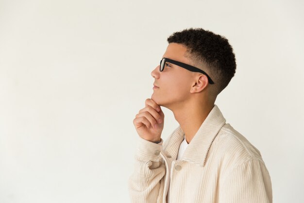 Pensive man in eyeglasses looking aside