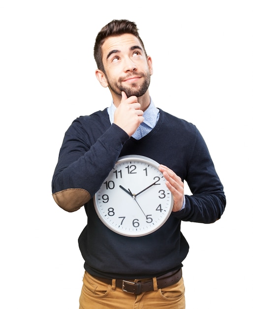 Pensive man with a big clock