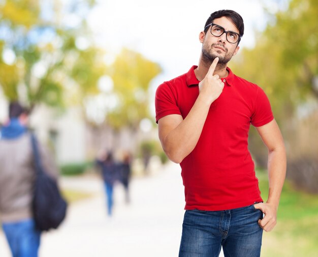 Pensive man with a finger on chin