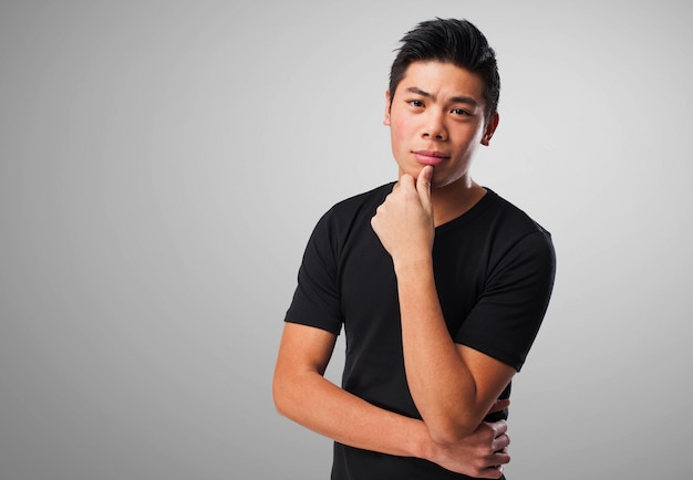 Pensive man with gray background