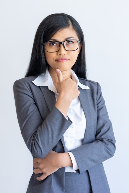 Pensive manager planning her day