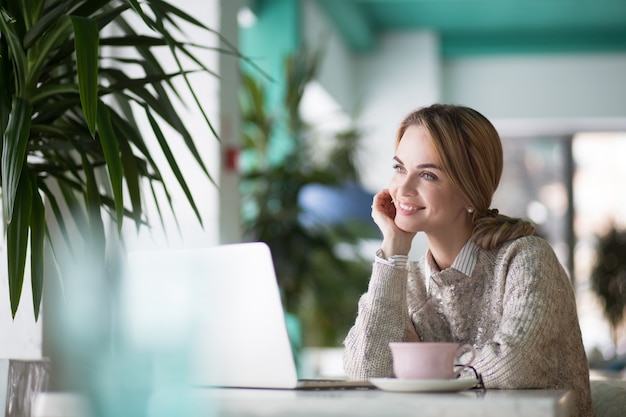 Free photo pensive sitting cafe lady young