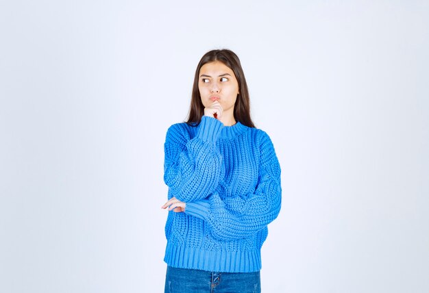 pensive young girl model standing and looking away.