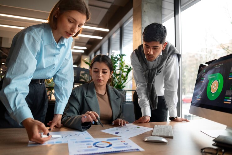 People analyzing and checking finance graphs in the office