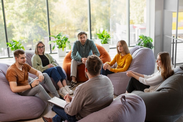Free Photo people attending therapy meeting