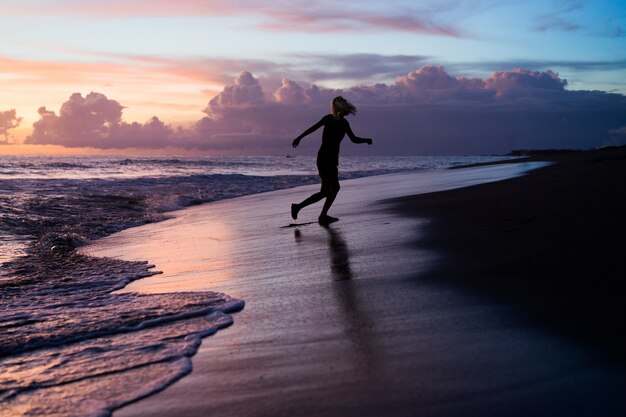 people on the beach at sunset. 