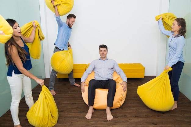 People Beating Their Scared Friend With Pillows