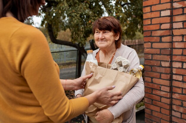 People bringing supplies to neighbors