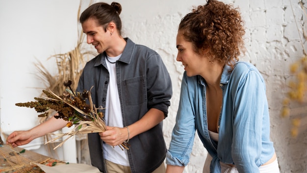 People building their own dried arrangement