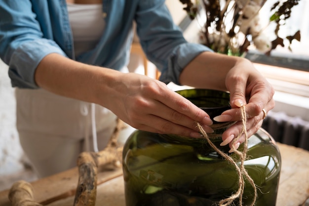 Free photo people building their own dried arrangement