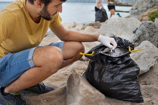 People cleaning garbage from nature