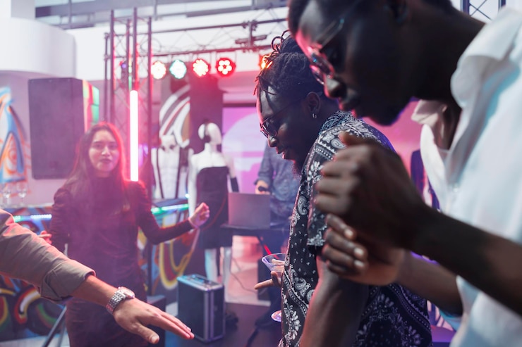 Free Photo people dancing and drinking in nightclub