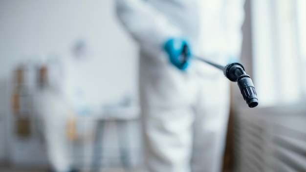 people disinfecting a biohazard area
