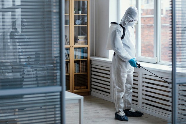 People disinfecting a biohazard area