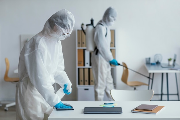 People disinfecting a biohazard area