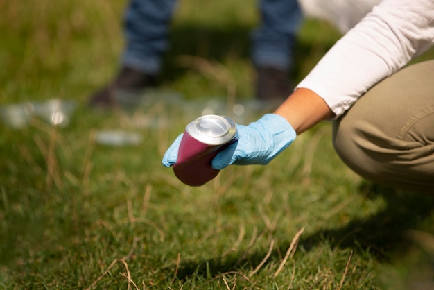 People doing community service by collecting trash together