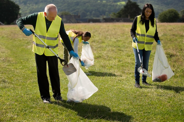 People doing community service by collecting trash