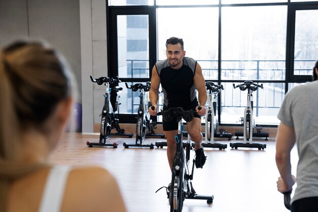 People doing indoor cycling