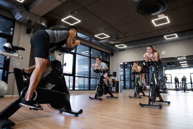 People doing indoor cycling