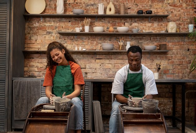 People doing pottery front view