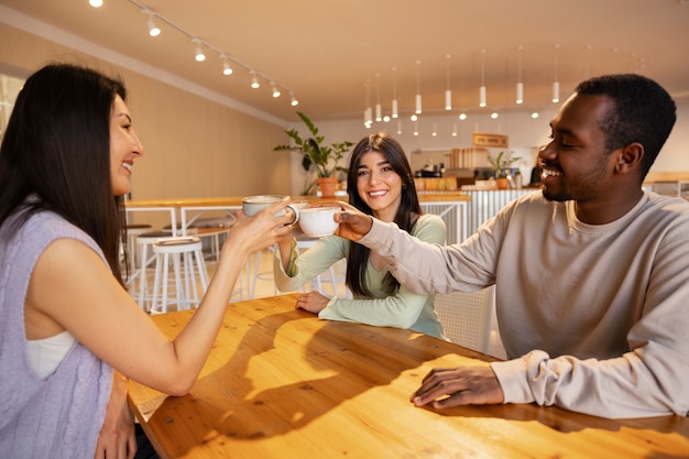 People drinking coffee in spacious cafeteria