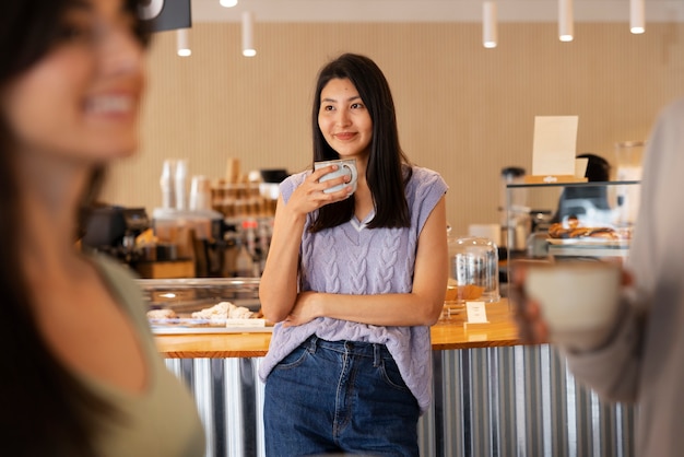 People drinking coffee in spacious cafeteria