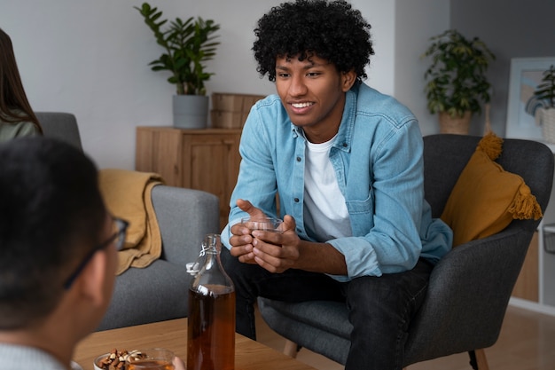 Free photo people drinking kombucha at a gathering