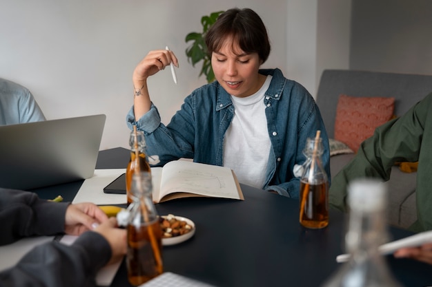 Free photo people drinking kombucha at a gathering