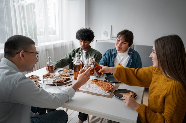 Free photo people drinking kombucha at a gathering