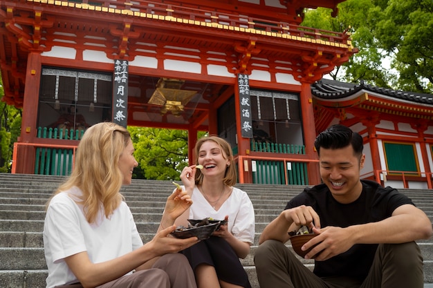 Free photo people eating seaweed snacks