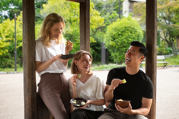 People eating seaweed snacks