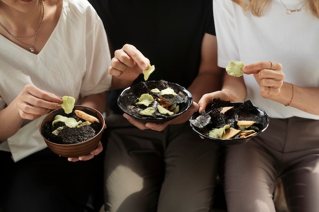 People eating seaweed snacks