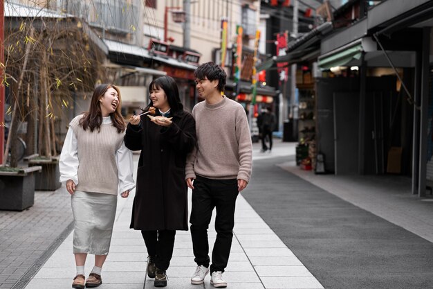 People enjoying japanese street food