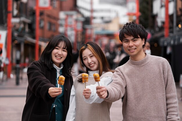 People enjoying japanese street food