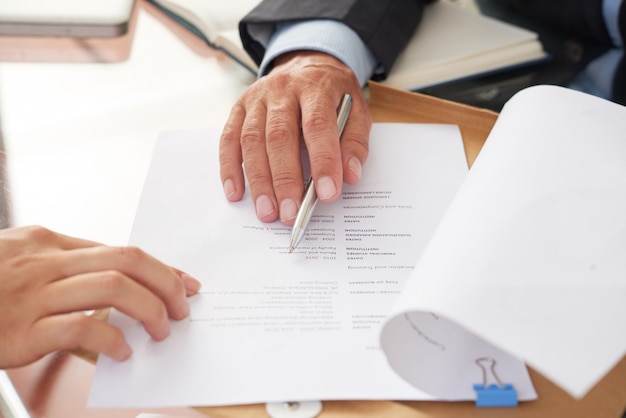 People examining business resume