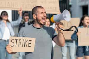 Free photo people gathered together for strike